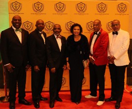 Jamaica’s Ambassador to the United States Audrey Marks center is flanked by members of the Washington based David Wagga Hunt Foundation L-R Garth Pottinger, Loxley O’Conner, Lloyd Anderson, Christopher Hunt, Chairman of the David Wagga Hunt foundation and Arnold Dullo McDonald at the foundation’s tenth annual Gala over the weekend at the National Education Association’s (Photo by Derrick Scott)
