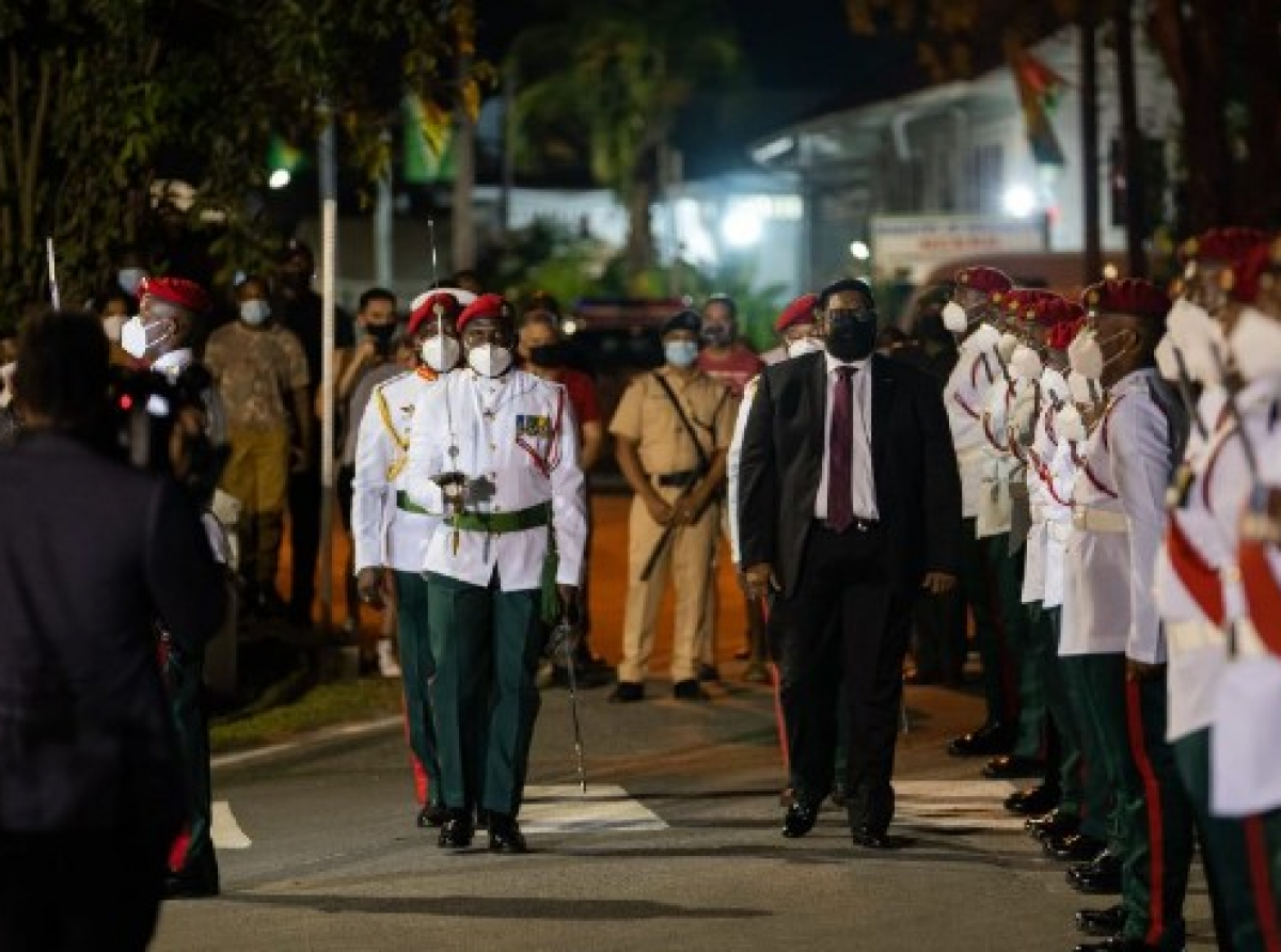 President Irfaan Ali inspects the Guard of Honour at the Flag Raising ceremony at Umana Yana Square, on Tuesday night.