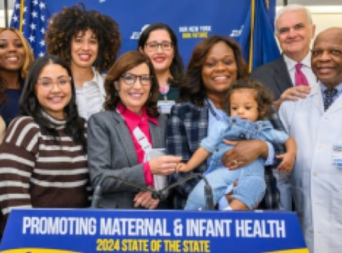 Governor Kathy Hochul with Haitian-American Assemlbywoman Rodneyse Bichotte Hermelyn and her son to the Governor’s immediate left