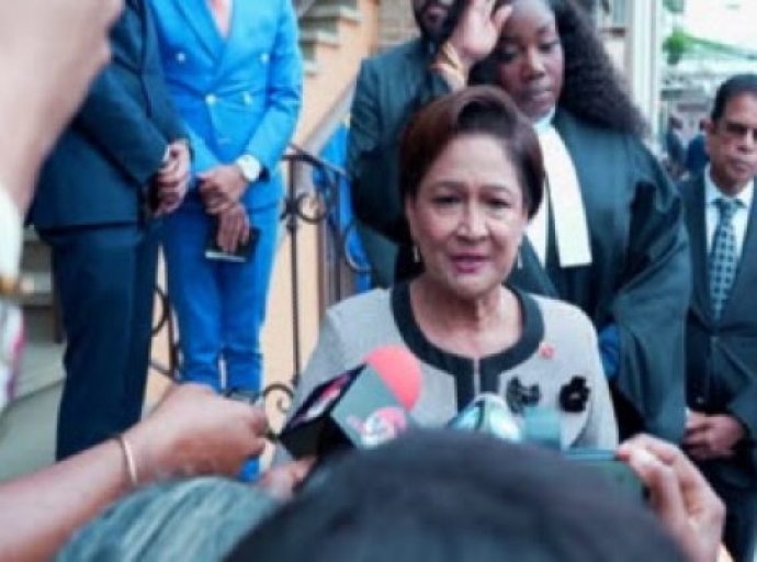 Prime Minister Kamla Persad-Bissessar speaking to reporters in Tobago (CMC Photo)
