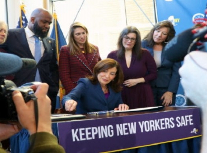 New York Governor, Kathy Hochul signs Melanie’s Law into effect, flanked by Assembly Member Brian Cunningham, second from left.