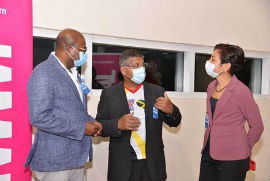 Minister of Tourism Hon. Edmund Bartlett (left) in conversation with British High Commissioner to Jamaica Asif Ahmad (centre) and Diane Corrie of British Airways following the return of British Airways service from London at the Sangster International Airport on Saturday