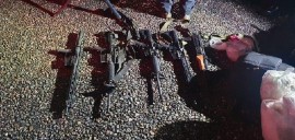 Assault rifles linked to the Belizean government were found. Police officers are among several people charged in connection with the drug bust. (BBN Photo)