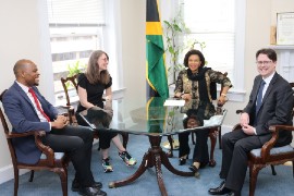 Jamaica’s Ambassador to the United States, Her Excellency Audrey Marks shares a light moment with the Senior Director of Strategic Planning & Airline Partnerships for Southwest Airlines, Steven Swan (right) as he, along with the Senior Manager for Governmental Affairs and International & Political Programs for the Airline Jenn Poeppelmeier (left) paid a courtesy call on the Ambassador on February 7, at the Embassy of Jamaica in Washington DC. At Left is Community Relations Official at the Embassy, Mr. Emile Wallace-Waddell. (Photo by Derrick Scott)