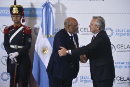 Haitian Prime Minister Dr. Ariel Henry (Left) greeted by Argentina's President Alberto Fernandez on his arrival at CELAC summit. (Photo credit: Gustavo Garello - stringer, AP)