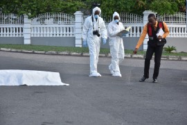 Forensics experts at a crime scene in Jamaica (JCF photo)