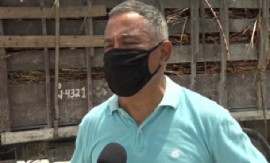 Prime Minister John Briceño speaking to reporters