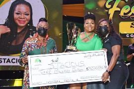 Reggae/Dancehall artiste Stacious (centre) receives her first place trophy and cheque for $3 million dollars for her winning 2021 Festival SongJamaican Spirit, from Minister of Culture, Gender Entertainment and Sport, Olivia Grange (left) and Digicel Brand Marketing Manager Reshima Kelly-Williams, a sponsor of the competition.
