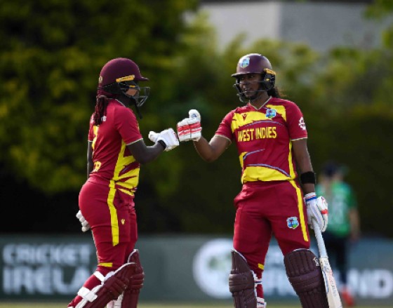 West Indies captain Hayley Matthews (r) bumps fist with Stafanie Taylor during the 1st T20 International against Ireland in Dublin on Thursday. Photo: CWI Media