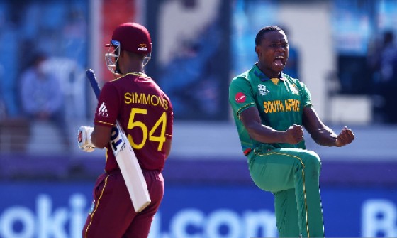 Lendl Simmons trudges off following his pedestrian 16 from 35 deliveries against South Africa on Tuesday, as fast bowler Kagiso Rabada celebrates.