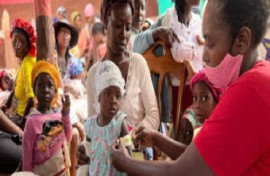 A child gets medical attention in Haiti (EU Photo)