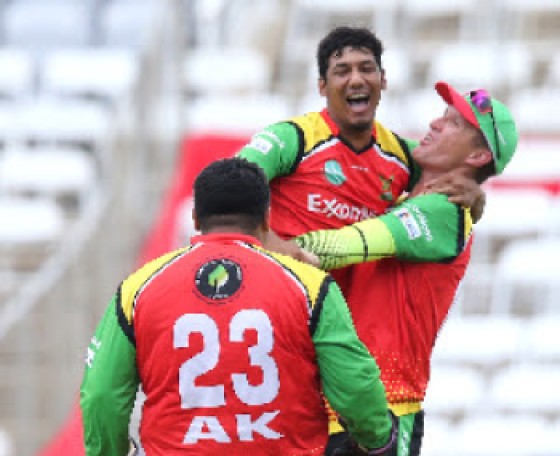 Off-spinner Gudakesh Motie (centre) celebrates after bowling Guyana Amazon Warriors to victory on Sunday. (Photo courtesy CPLT20/Getty Images)