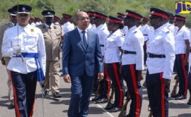 National Security Minister Dr. Horace Chang inspecting new recruits of the JCF at a passing our parade last year (JIS Photo)