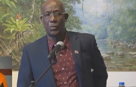 Prime Minister Dr. Keith Rowley speaking to reporters prior to his departure for Suriname (CMC Photo)