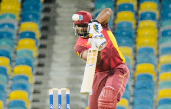 Kieron Pollard plays through the off side during his half-century.