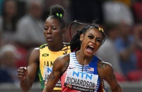 Sha’Carri Richardson celebrates after beating Shericka Jackson on the final leg of the women’s sprint relay final.