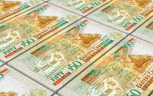 Eastern Caribbean dollar bills stacked background. 3D illustration.