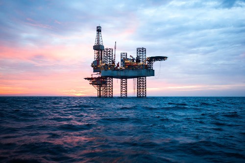 Offshore Jack Up Rig in The Middle of The Sea at Sunset Time