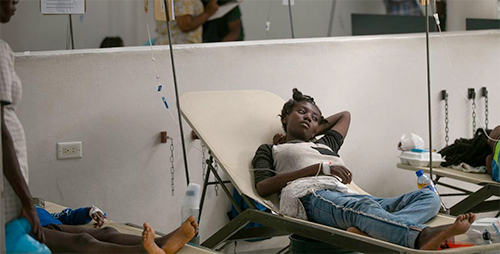  A woman suffering from cholera is treated at a hospital in Port-au-Prince, Haiti. (UNICEF/Odelyn Joseph)