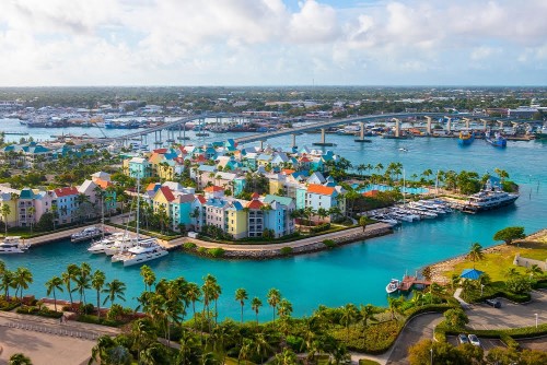 Harborside Villas aerial view at Nassau Harbour with Nassau downtown at the background, from Paradise Island, Bahamas.