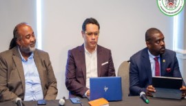 Agriculture, Fisheries and Marine Resources Minister, Samal Duggins, (right) and Lynch Caribbean Brokers managing director, Damian Bowen (left) explaining the REAP project.