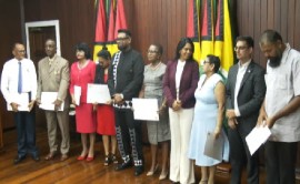 President Irfaan Ali (fifth from left) with members of the Teaching Service Commission (CMC Photo)