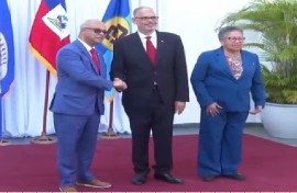 OAs Secretary General Albert Ramdin is greeted by Prime Minister Alix Didier Fils-Aimé. ahead of their talks. Also present is CARICCOM Secretary General, Dr. Carla Barnett (CMC Photo)