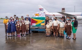 Guyana school children witness the donation of vaccines from Spain (DPI Photo)