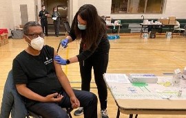 Dr. Asefa Jejaw Mekonnen receiving his COVID-19 vaccine.