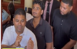 Opposition Leader Azruddin Mohamed (front) and his two workers entering the court building on Friday.
