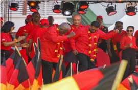 Vice President Bharrat looks on as President Irfaan Ali and Prime Minister Brigadier (Ret’d) Mark Phillips show off their dancing skills at the launch of the PPP/C election campaign on Sunday.