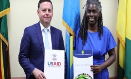 USAID’s David Billings and OECS’s Dr. Carlene Radix (OECS Photo)
