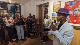 Paul Campbell addresses an audience at his November 18 art show opening for Color and Time at Island SPACE Caribbean Museum. (Photo credit: Island SPACE Caribbean Museum)
