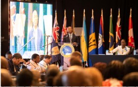 CDB President Dr. Gene Leon addressing the opening of the 52nd annual meeting of the board of directors (CMC Photo)