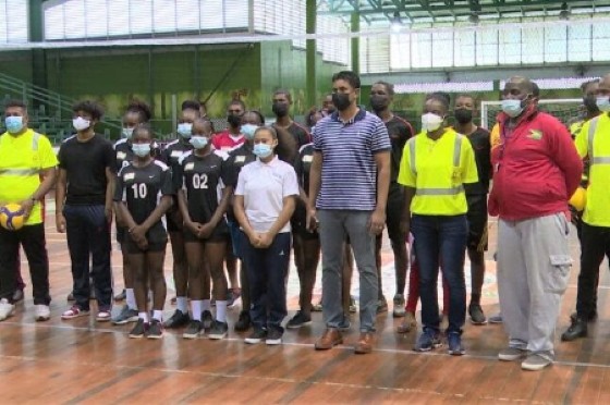 Minister of Culture, Youth and Sport Charles Ramson Jr. with some of the players and officials at the launch of the National Sports Academy.