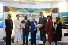 Baroness Jennifer Chapman and British High Commissioner Thomas Hartley give archival gifts to Prime Minister Philip ‘Brave’ Davis and Education Minister Glenys Hanna Martin