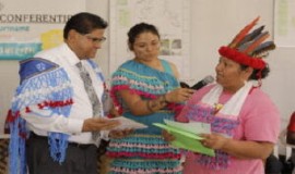 President Chan Santokhi receives the results of the three-day VIDS conference from the new president Muriël Fernandes. (SCS Photo)