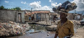 A man walks through Cité Soleil, one of the neighborhoods of Haiti's capital, Port-au-Prince, most affected by gang violence. (UNICEF/Georges Harry Rouzier)