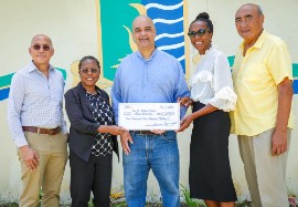 CMEx representatives present a contribution to The St. Michael School Alumni Association during a visit to Barbados. Pictured, from left, are Leslie Welch; Principal Tanya Harding; Bevan Springer; President of the St. Michael School Alumni Association Renee Coppin; and Lelei LeLaulu. The contribution has helped enhance classroom technology and support student development initiatives at the school.