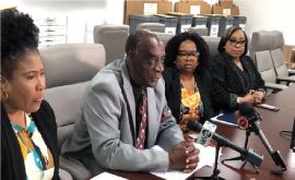 Parliamentary Commissioner Harrison Thompson speaking at news conference.