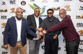 Jamaica Strong Executives (L-R) Bobby Clarke, Irie Jam radio; Kacy Rankine, Roadblock radio and George Crooks (R), Jammins Events share lens time with Grammy winning dancehall/reggae icon Shaggy (2nd from R). (Photo Credit: Sam Johnston/UBS Arena)