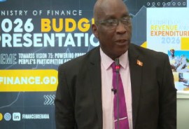 Finance Minister Dennis Cornwall presenting the 2026 national budget to Parliament (CMC Photo)