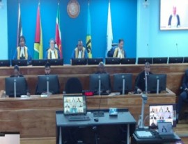CCJ President, Justice Winston Anderson (second from left) delivering the ruling in the case between political analyst Derek Ramsamooj and the state of Suriname (CMC Photo)