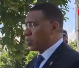 Prime Minister Andrew Holness speaking to reporters following Monday night’s murders.