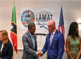 Prime Minister Dr. Terrance Drew (left) greeting U.S. Air Force Lt. Col. Barry Davis, general surgeon and LAMAT 2026 mission commander at the launch of the programme.