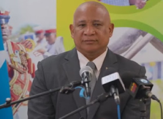 Tourism Minister Dr. Ernest Hilaire speaking to reporters on the Uber issue (CMC Photo)