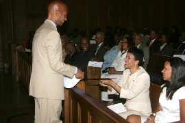 Jamaica’s ambassador to the United States, Her Excellency Audrey Marks, accepts a scroll proclaiming August 6 as “Jamaica’s Independence Day in Washington DC,” from Washington DC forma Mayor Adrian Fenty during the Jamaican Independence Service of Thanksgiving at Howard University’s Dumbarton Chapel. At right in Mrs. Michelle Fenty (Photo by Derrick Scott)