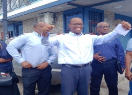 UWP leader, Dr. Thomson Fontaine, center, flanked by former prime minister Edison James (right) and Lennox Linton emerging from the court on Friday (CMC Photo)