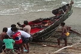 Residents of St. Vincent and the Grenadines examine the remnants of the vessel allegedly blown up at sea by US military last Friday.