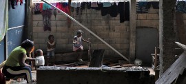 Families displaced by gang violence in the Haitian capital Port-au-Prince live in a school before being relocated by the UN (Photo via IOM/Monica Chiriac)